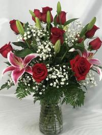 12 roses and 3 stargazer lilies